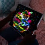 The Lite-Brite Classic, Bold & Bright Edition glowing in the dark displaying an ice cream design