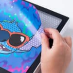 Photo shows how you can change the back drop of the Lite-Brite ColorPOP! Stitch