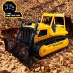 Photo of the Tonka Retro Bull Dozer staged in rock