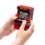 Someone playing with the Arcade Classics Mortal Kombat Handheld Arcade Game