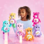 Little girl playing with the Care Bears Sparkle fun sized collection