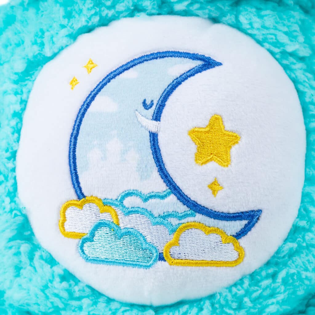 Belly Badge on the Care Bears Medium Cozy Bedtime Bear Plush