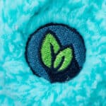 Eco Friendly foot badge on the Care Bears Medium Cozy Bedtime Bear Plush