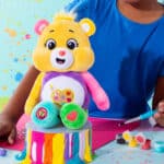 Child playing with the Work of Heart Bear from the Fun Size Sparkle Collection
