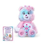 Sitting photo of the Care Bears Collector's Edition Snowflake Sparkle Bear with the card of authentication
