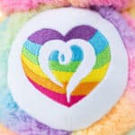 Close up of the Belly Badge on Care Bears Medium Cozy Togetherness Bear Plush