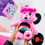 Someone holding up Care Bears - 14" Medium Plush - Rock-a-Lot Cheer Bear