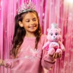 Little girl playing with the Love-A-Lot Bear as Glinda