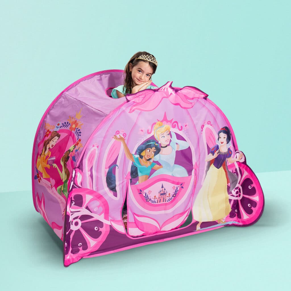 Little girl playing in the Playhut Disney Princess Carriage Crawl Through