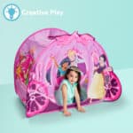 Little girl playing in the Playhut Disney Princess Carriage Crawl Through
